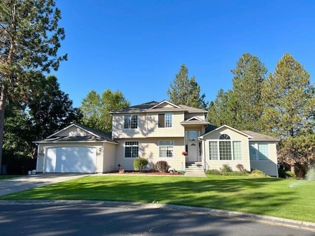 split level home featuring a garage and a front yard