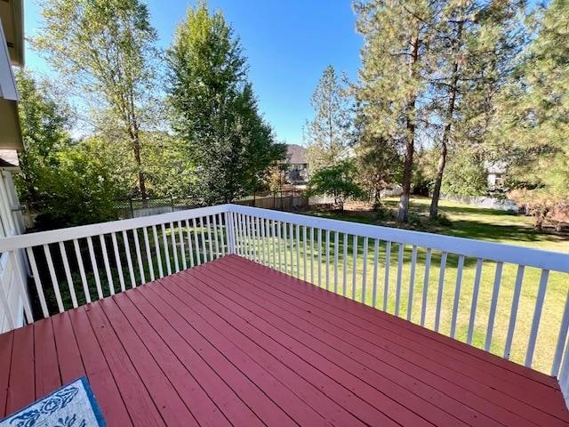 wooden terrace with a yard