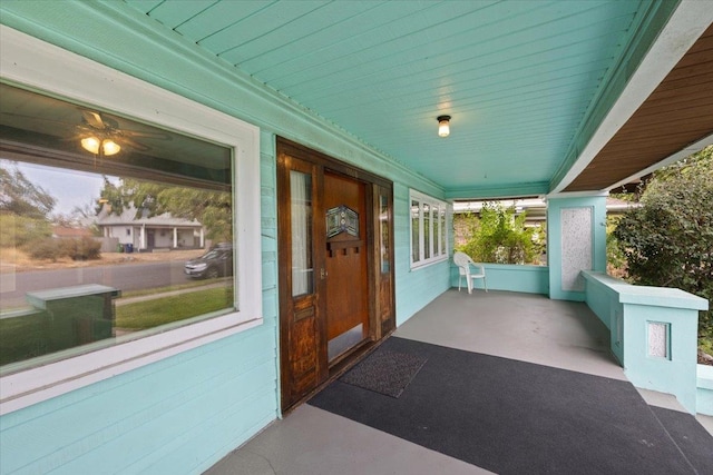 view of exterior entry with covered porch