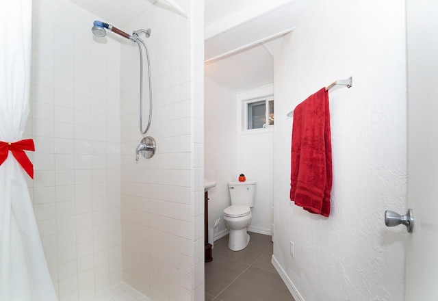 bathroom featuring tile patterned flooring, toilet, and a shower with shower curtain