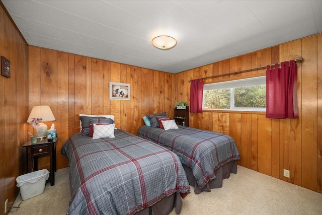 bedroom featuring carpet floors and wooden walls