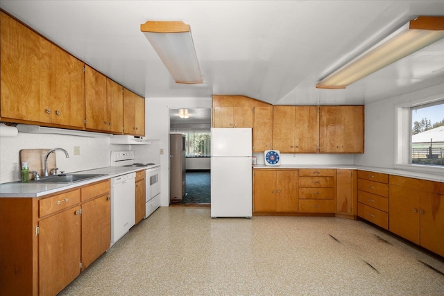 kitchen with sink, white appliances, and extractor fan