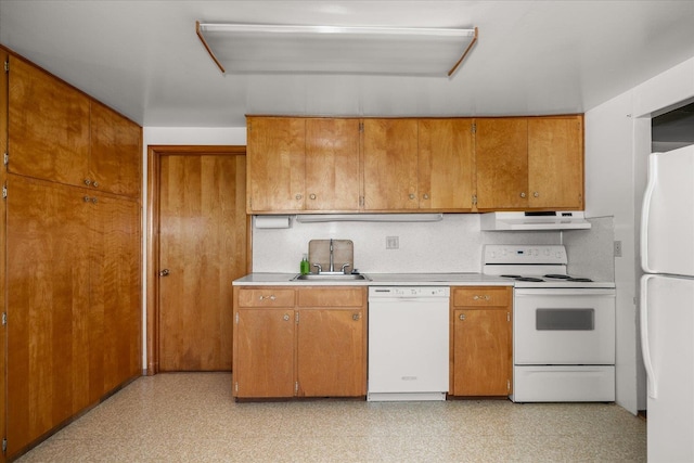 kitchen with sink and white appliances