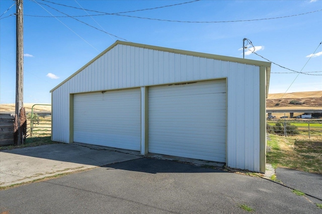 garage featuring wooden walls