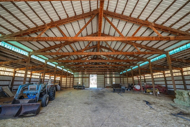 miscellaneous room with beamed ceiling and high vaulted ceiling