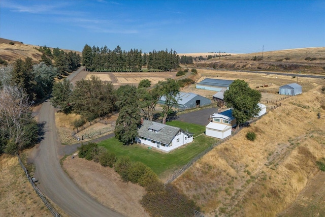 birds eye view of property featuring a rural view