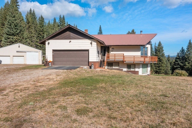 view of front of house featuring a front yard, metal roof, a chimney, and dirt driveway