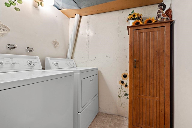 laundry room featuring washer and dryer and laundry area