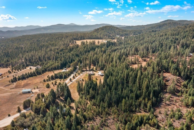 aerial view with a view of trees and a mountain view