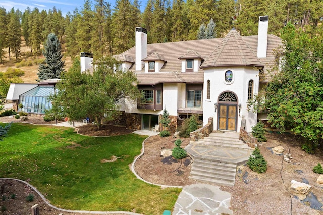 3206 W Long Prairie Rd, Valley, WA 99181 - view of front facade featuring a chimney, stucco siding, french doors, and a front yard