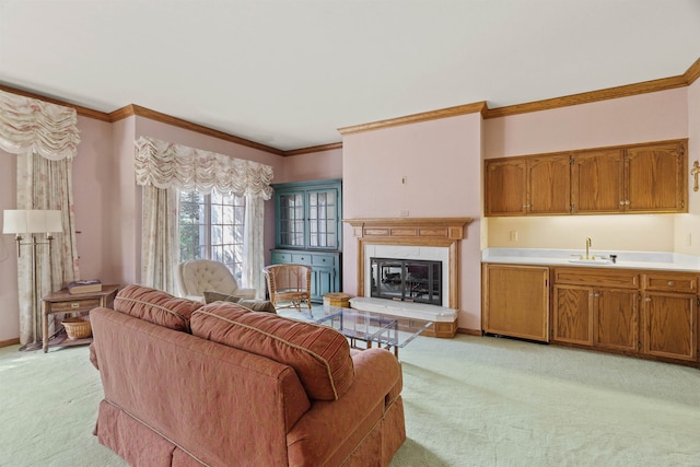 living room with sink, crown molding, and light carpet