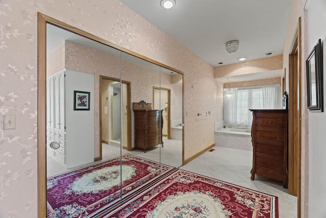 hallway featuring light tile patterned floors