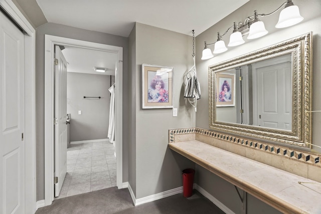 bathroom with tile patterned flooring