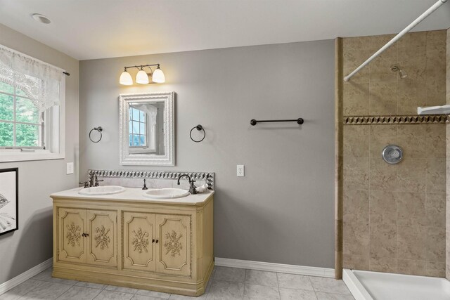 3206 W Long Prairie Rd, Valley, WA 99181 - full bathroom with baseboards, double vanity, and tiled shower