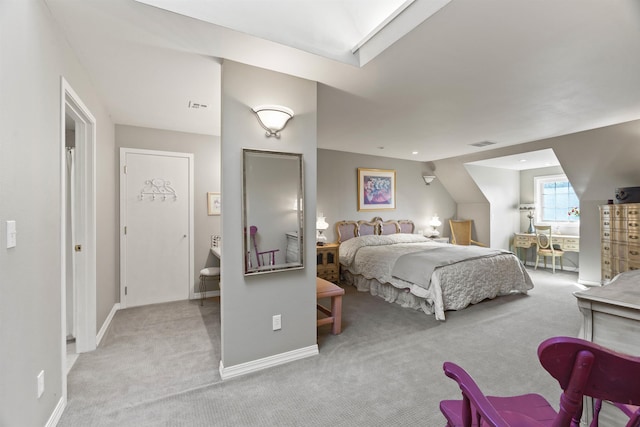 bedroom with lofted ceiling and light carpet