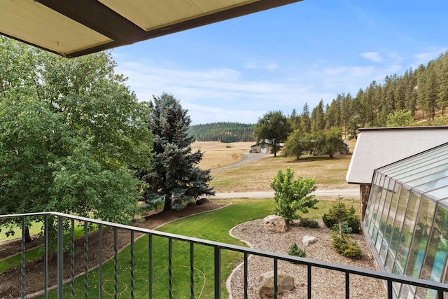 view of yard featuring a balcony