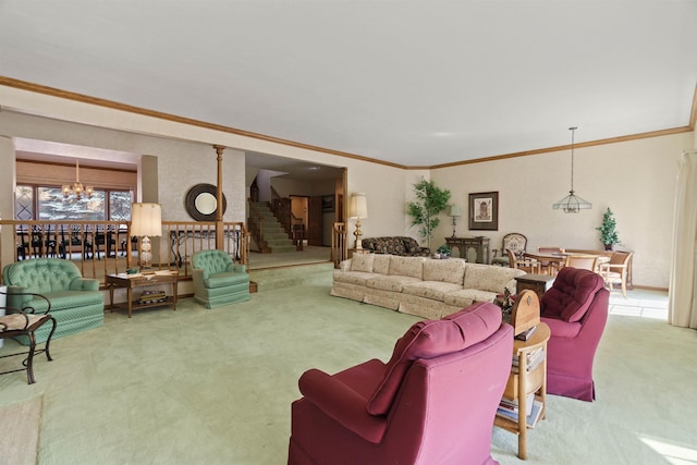 living room featuring carpet flooring, crown molding, decorative columns, and a notable chandelier