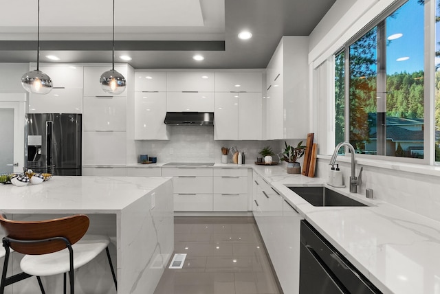 kitchen with white cabinetry, hanging light fixtures, a spacious island, and light tile patterned flooring