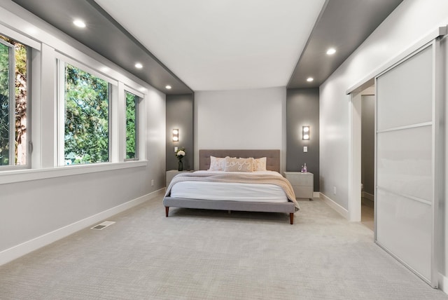 bedroom featuring light colored carpet