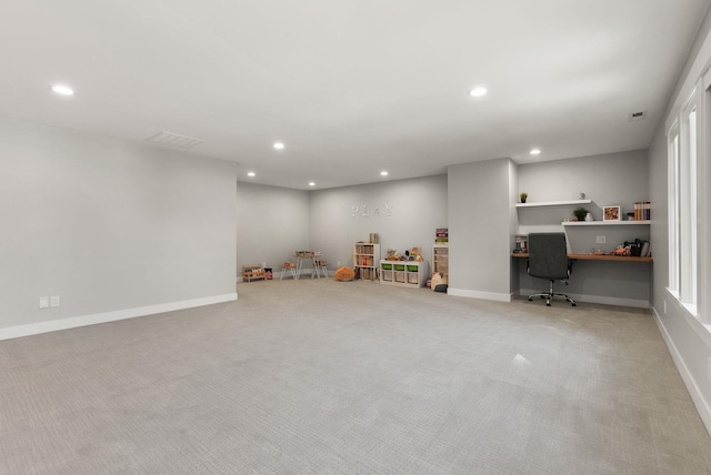 basement with light colored carpet