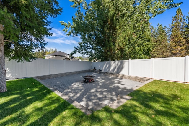 view of patio / terrace with a fire pit