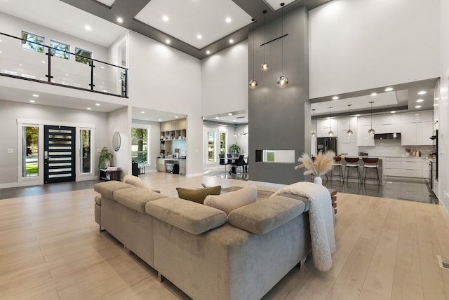 dining room featuring light tile patterned flooring, a raised ceiling, and a notable chandelier