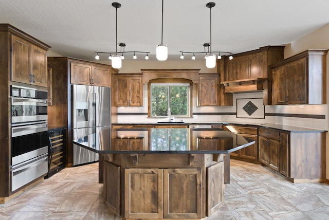 kitchen with a sink, stainless steel appliances, a center island, a warming drawer, and wine cooler