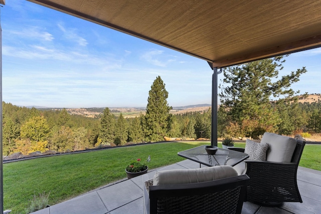 view of patio with a forest view
