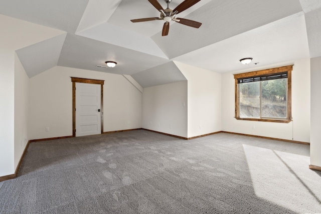 additional living space with a ceiling fan, baseboards, vaulted ceiling, and carpet floors
