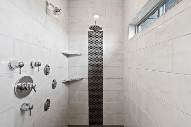 bathroom with a tile shower