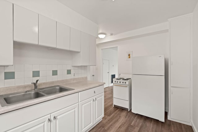 kitchen featuring dark hardwood / wood-style floors, tasteful backsplash, sink, white cabinets, and white appliances