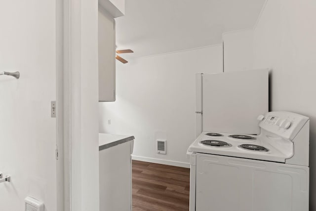 kitchen with white refrigerator, washer / dryer, ceiling fan, and dark hardwood / wood-style flooring