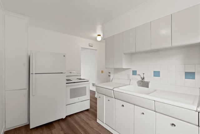 kitchen with white cabinets, white appliances, dark hardwood / wood-style floors, and tasteful backsplash