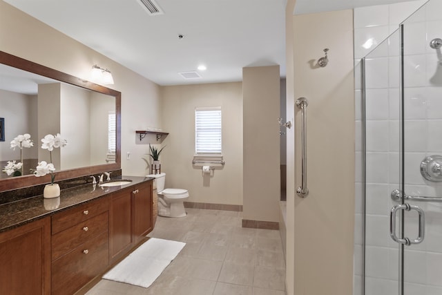 820 N Post St Unit 106, Spokane, WA 99201 - bathroom with toilet, visible vents, a shower stall, and vanity