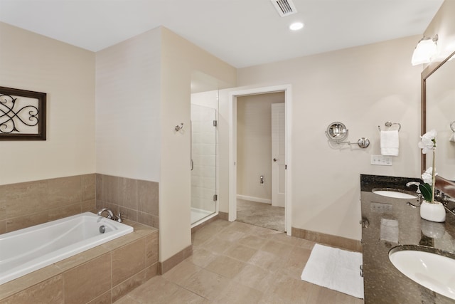 bathroom featuring plus walk in shower, tile patterned flooring, and vanity