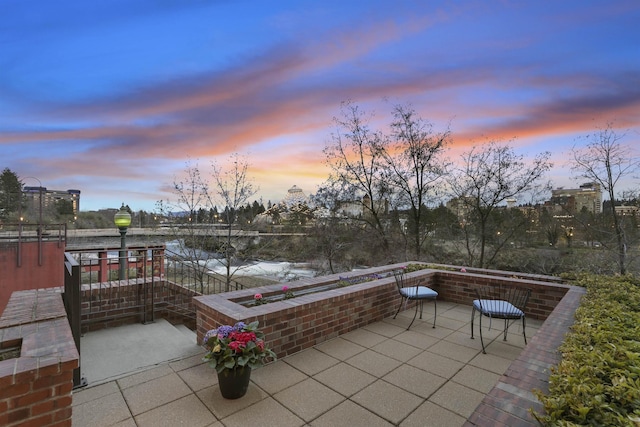 820 N Post St Unit 106, Spokane, WA 99201 - view of patio terrace at dusk