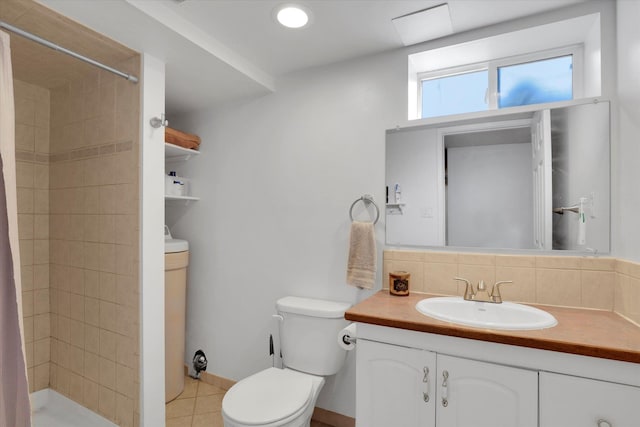 bathroom featuring decorative backsplash, vanity, walk in shower, toilet, and tile patterned floors