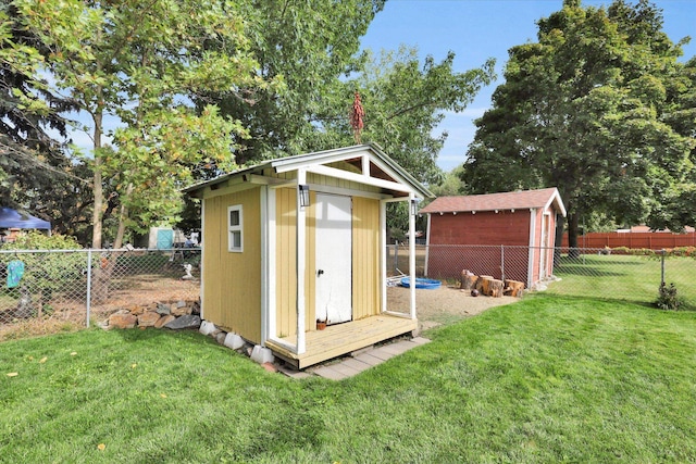 view of outbuilding featuring a lawn