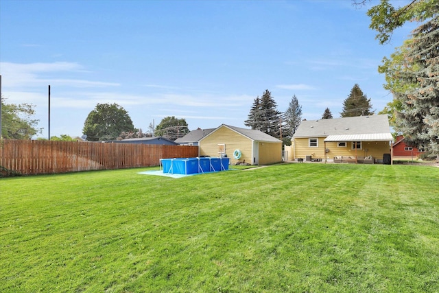 view of yard featuring a fenced in pool