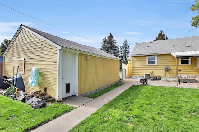 exterior space with a lawn and cooling unit