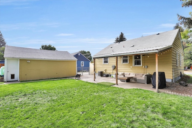 back of property with a lawn, an outdoor hangout area, a patio area, and cooling unit