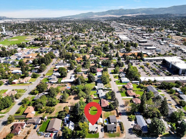 birds eye view of property featuring a mountain view