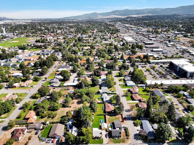 birds eye view of property with a mountain view