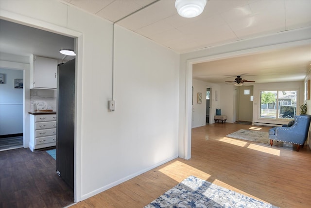 hallway with dark wood-type flooring