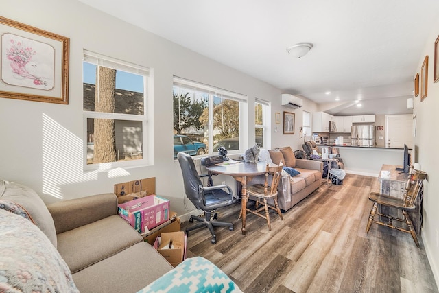 2213 E E Gordon Ave, Spokane, WA 99207 - living room with a wall mounted air conditioner, wood finished floors, and recessed lighting