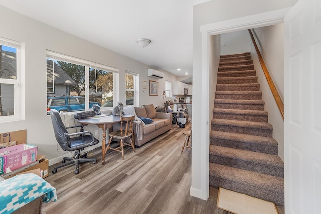 2213 E E Gordon Ave, Spokane, WA 99207 - stairs featuring wood finished floors, a wall mounted air conditioner, recessed lighting, and baseboards