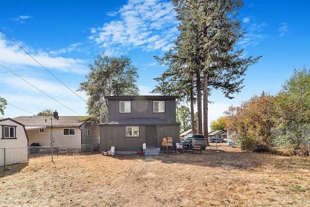 2213 E E Gordon Ave, Spokane, WA 99207 - back of property featuring a fenced backyard and entry steps