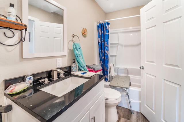 2213 E E Gordon Ave, Spokane, WA 99207 - bathroom featuring toilet, vanity, shower / bath combo with shower curtain, and wood finished floors