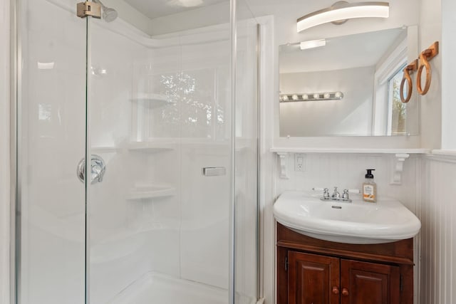 bathroom with vanity and an enclosed shower