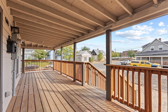 wooden deck with a storage shed